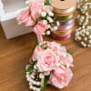A soft and romantic set featuring blush pink roses, delicate baby&rsquo;s breath