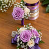 An elegant set featuring soft lavender and ivory roses accented with baby&rsquo;s