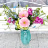  Bold pink gerbera daisies take center stage in this Tiffany Garden