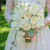 This elegant bridal hand-tied bouquet features  stunning white phalaenopsis orchid, 