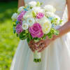 This elegant bridal hand-tied bouquet features  soft pink and white roses