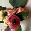 Soft pink roses and ranunculus  accented with touches of eucalyptus