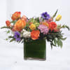 Blythe is a vibrant, modern floral arrangement designed with bold color, playful