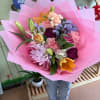 A vibrant, handcrafted bouquet designed to brighten any moment. This arrangement features