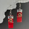 Glossy red rectangular drops catch the eye first - these dangle earrings