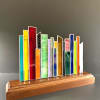 A vibrant tabletop stained glass sculpture that reads like a miniature city