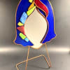 A cobalt blue stained-glass face-shaped sculpture brings modern art gifting to the