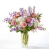 Soft pink roses and billowy white hydrangeas mingle with airy lavender stock