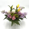 Spring Whisper is a graceful arrangement featuring soft pink roses, elegant white
