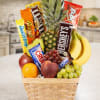 Fruit basket with candy bars and bananas in a woven basket