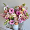 A romantic mix of peachy pink blooms, thoughtfully arranged for your love