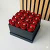 Box of red roses topped with pearl accents