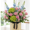 Revel in the freshness of our floral arrangement featuring green hydrangeas, pink
