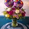 A burst of congratulatory color-this Purple Celebration Bloom bouquet makes the recipient