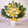Sunshine yellow roses and cheerful chrysanthemums take center stage in this yellow