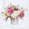 Blush is a soft, romantic floral arrangement designed with delicate color, lush