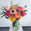 A bright, garden-style arrangement designed with a playful mix of color and