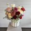 A soft, romantic arrangement designed with a timeless, garden-inspired feel. Featuring a