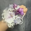 Purple calla lilies and lavender orchids, rhinestone picks and layered ribbons-an elegant
