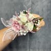 White and blush pink spray roses with white fillers, sheer pink ribbon