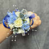 Royal Blue and white wrist corsage with spray roses, blue accents, finished