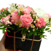 A stunning blend of fashion and floral art. This chic, black quilted