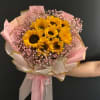 This cheerful bouquet features 10 glowing sunflowers, symbolizing happiness, warmth, and positivity.