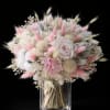 A cloudlike cluster of pastel blooms-soft white, lavender, peach and pink-makes this