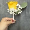 Bright yellow rose with white filler and greenery ;beautifully hand-wrapped boutonni&egrave;re