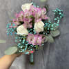 Pink alstroemeria and white roses with bright aqua baby's breath and eucalyptus