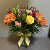 A luscious bouquet filled with pink, peach and lavender to celebrate spring
