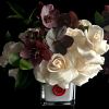 Roses and Hellebores in white glass vase.
