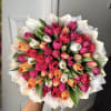 A bright, hand-tied tulip bouquet that says "she loves tulips" the moment