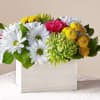 Mixed bouquet of white daisies, yellow mums, and pink flowers in a white box