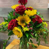 A sunflower and rose arrangement is the perfect combination of vibrant, rustic