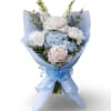 A soft and elegant hand-wrapped bouquet inspired by Columbia University, featuring delicate
