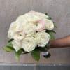 A beautifully hand-tied bouquet designed in a tight, compact style, where each