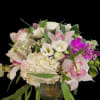 Pink and white floral arrangement in a glass vase