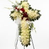 Featuring a variety of white flowers: White Roses, White lilies, Red roses