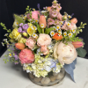 A designer's choice soft pastel garden mix of the season's freshest blossoms.