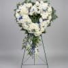A large heart-shaped standing spray crafted in serene whites and cool blues