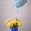 Sunlight yellow roses and pale yellow carnations arranged with crisp white filler