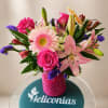 Bright, feminine, and full of joyful color, this flower arrangement is a