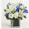 SMALL A delicate and charming floral arrangement featuring crisp white roses paired
