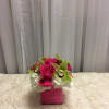 Pink rose and orchid arrangement in a square pink box