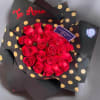 A dense cluster of vivid red roses is gathered into a perfectly
