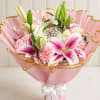 A soft and romantic hand-tied bouquet featuring pink stargazer lilies, white roses