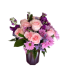 Lavender chrysanthemums and blush pink roses mingle with pink carnations and deep