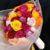 Bouquet of multicolored roses wrapped in striped paper