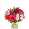 Pink and red mixed bouquet in a clear glass vase